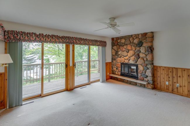 Primary bedroom suite features this beautiful stone fireplace! | Image 22