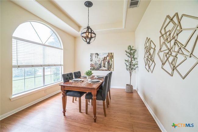 This space is currently being used as a formal dining, but in the past it's been a formal living, a dedicated office and a playroom. | Image 8