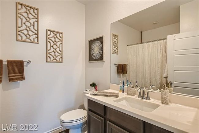 Full bath with a shower with shower curtain, toilet, and vanity | Image 10