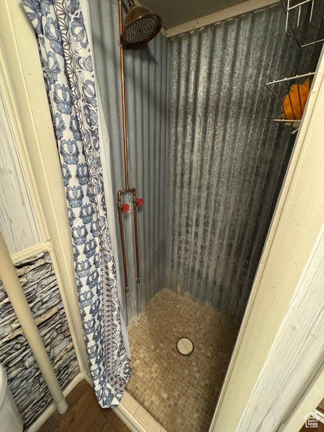 Full bath with a shower and wood finished floors | Image 9