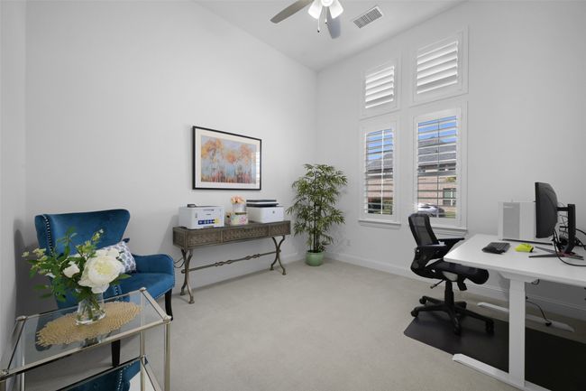 Study/Office at the front of the house with fan and plantation shutters. | Image 33