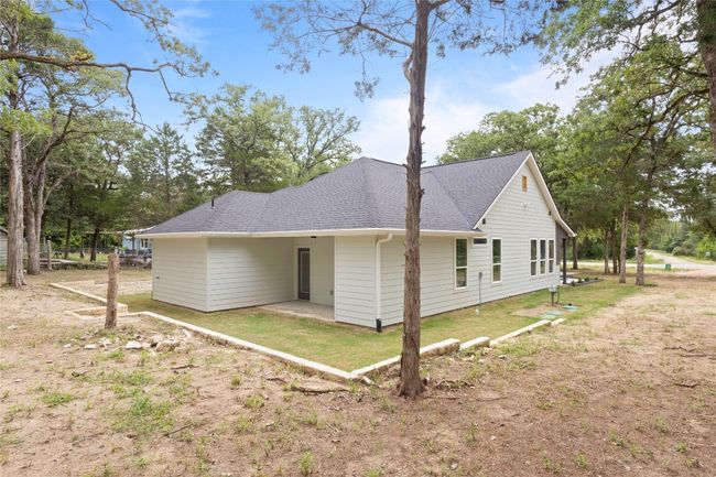 A breathtaking side view of a sprawling backyard—nearly an acre—surrounded by stunning nature. Make it yours! | Image 29