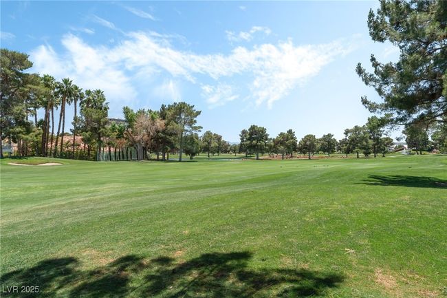 View of property's community featuring a lawn and golf course view | Image 28