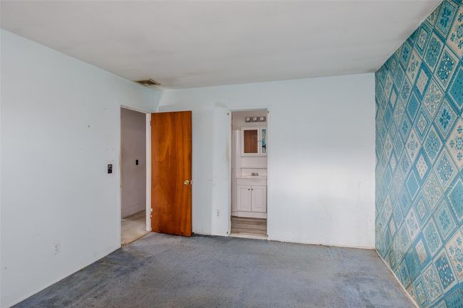 Unfurnished room featuring a sink and visible vents | Image 16