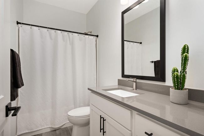 Full bathroom with quartz countertops splits 2nd and 3rd bedroom | Image 20