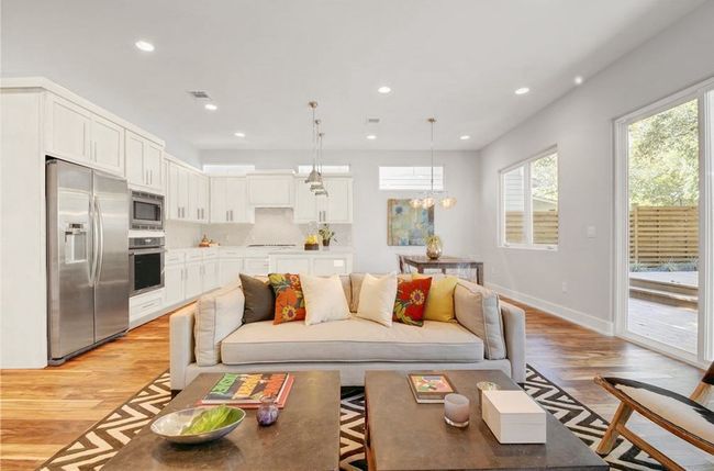 Living room featuring recessed lighting, baseboards, light wood finished floors, and visible vents | Image 10