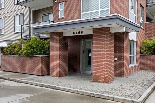 Doorway to property featuring brick siding | Image 19