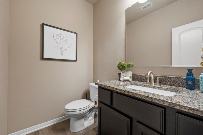 Half bathroom with wood finished floors and vanity | Image 13