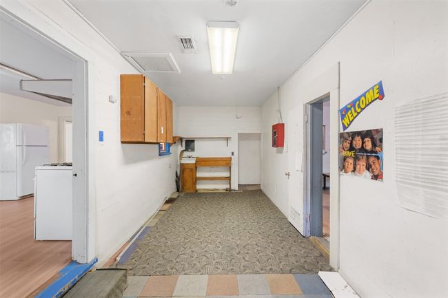Hall featuring light floors and visible vents | Image 13