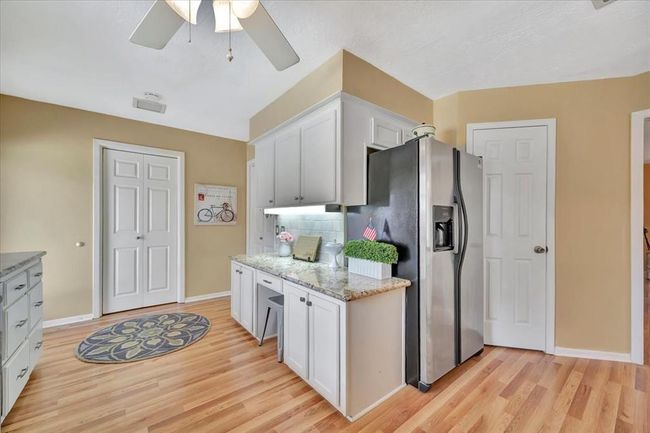 The downstairs laundry is just off the kitchen. | Image 23
