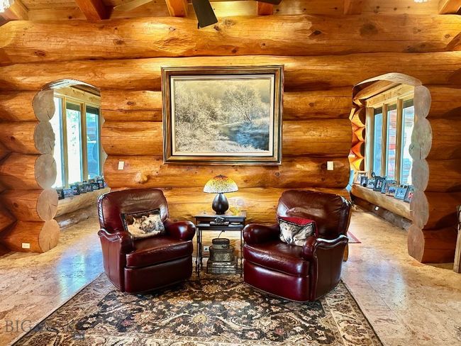 Entry area to primary suite with double arched doorways to bedroom. | Image 13