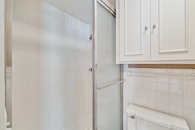Full bathroom featuring toilet and a shower stall | Image 27
