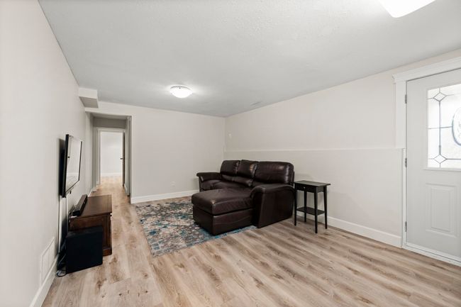 Living area with visible vents, baseboards, and wood finished floors | Image 28