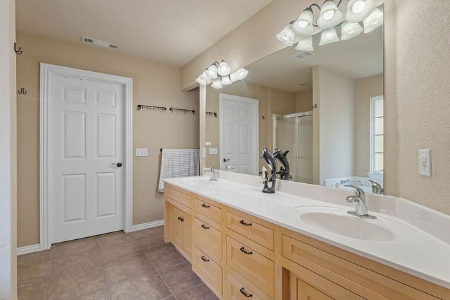 Primary bathroom with attached walk-in closet | Image 12