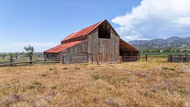 View of barn featuring a rural view and a mountain view | Image 13