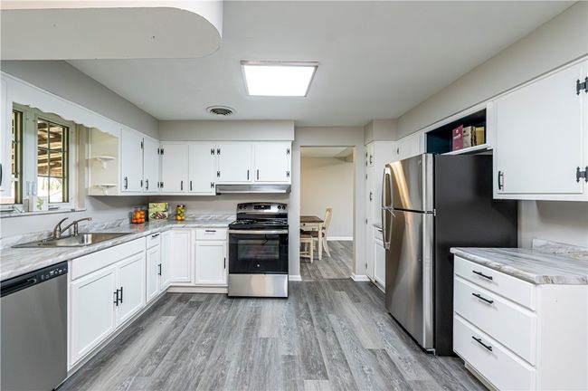 Check out the kitchen with many updates. It's great to have all new stainless steel appliances. | Image 13
