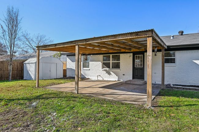 Back of house featuring brick siding and a patio | Image 23