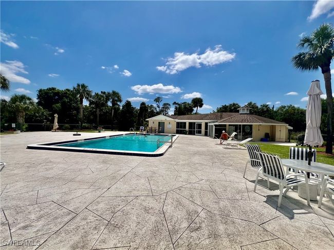 Pool featuring a patio area | Image 25