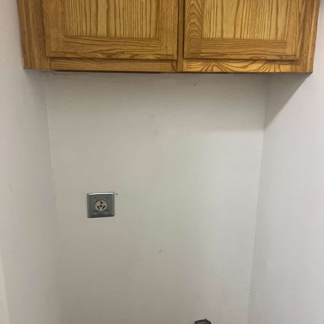 Laundry area featuring cabinet space | Image 18