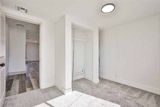 Unfurnished bedroom featuring a closet and carpet | Image 14