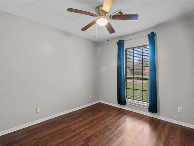 bedroom #1 with ceiling fan and easy to clean floors | Image 13