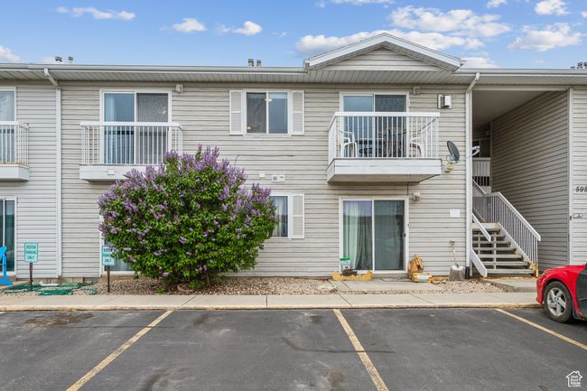 View of property featuring uncovered parking and stairway | Image 17