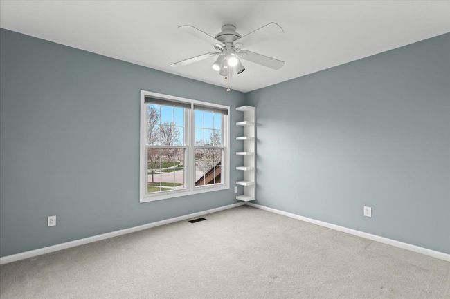 Bedroom w/walk in closet, ceiling fan | Image 18