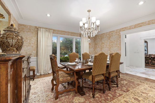 Formal Dining with views to the front and a beautiful chandelier | Image 6