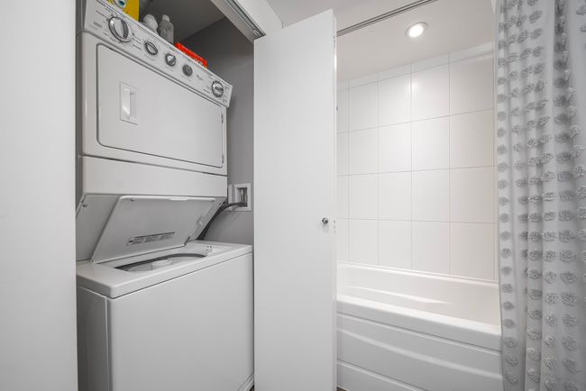 Laundry area with laundry area, stacked washer and clothes dryer, and recessed lighting | Image 19