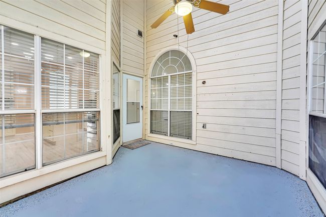 Property entrance featuring ceiling fan | Image 22