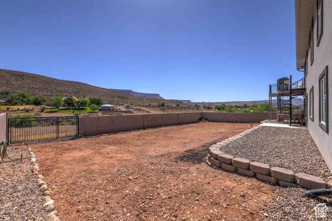 View of yard with a fenced backyard, stairs, and a mountain view | Image 28
