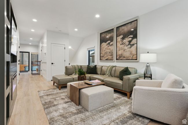 Living room featuring light wood-type flooring | Image 6