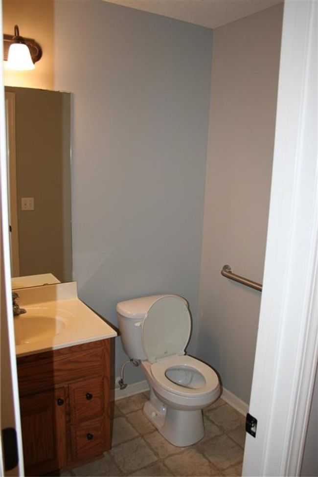 Half bathroom with vanity and baseboards | Image 20