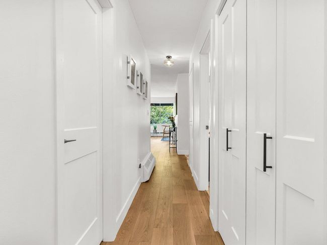 Hall featuring light wood-type flooring and baseboards | Image 17