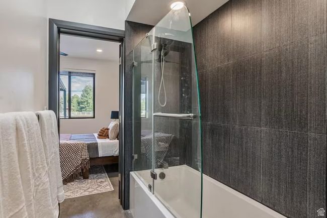 Bathroom featuring ensuite bath and bath / shower combo with glass door | Image 43