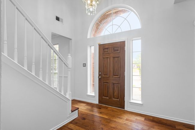 The two story entry is bright and does not open into a living space. | Image 4