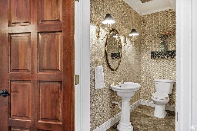 Half bath featuring ornamental molding and wallpapered walls | Image 45