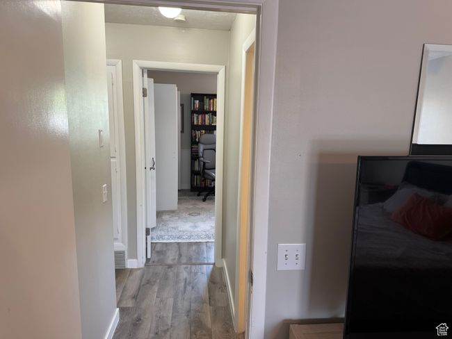 Hall featuring wood finished floors | Image 23