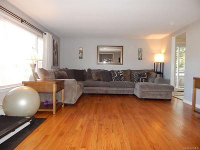 Living room with light hardwood / wood-style flooring | Image 2