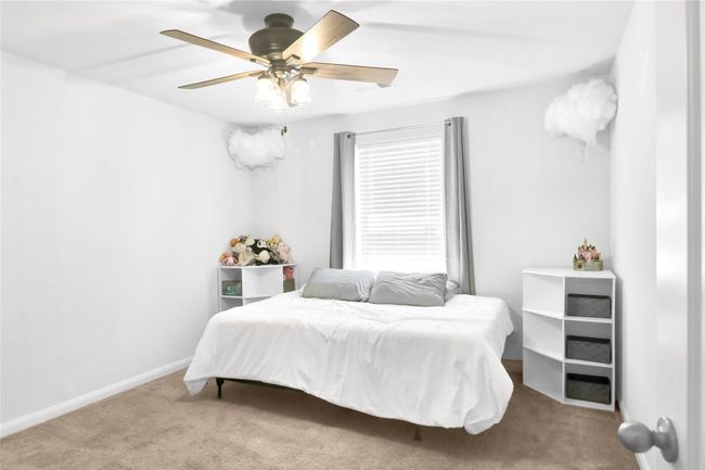 Carpeted bedroom with baseboards and ceiling fan | Image 23