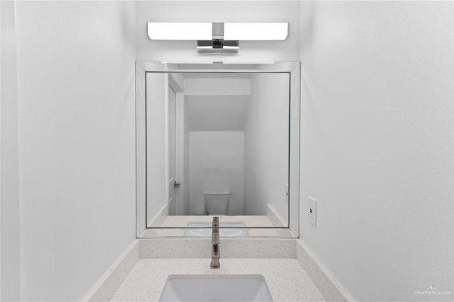 Bathroom featuring a sink and toilet | Image 18