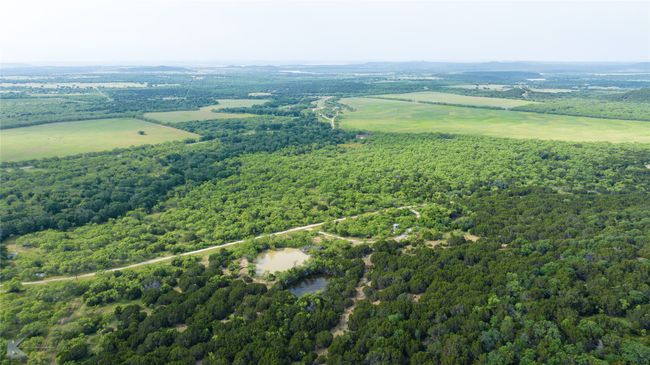 Aerial view of a heavily wooded area | Image 18