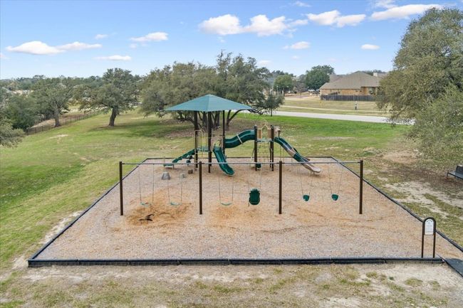 Community jungle gym featuring a yard | Image 40