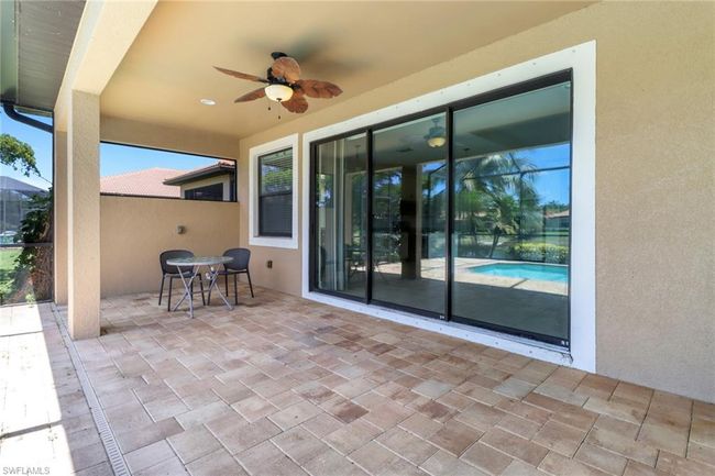 View of patio / terrace with ceiling fan and outdoor dining space | Image 7