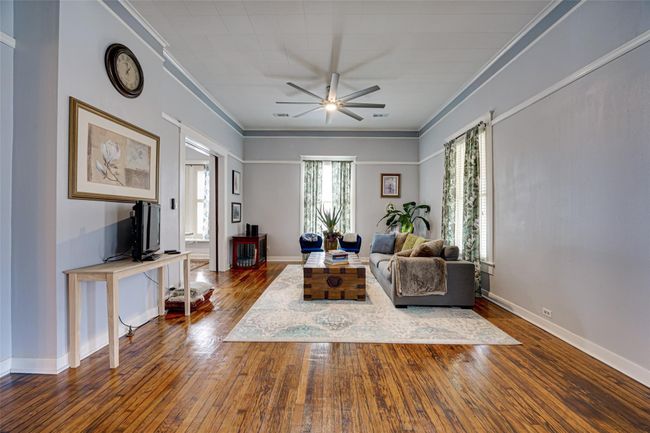 Living room with ceiling fan, ornamental molding, and hardwood / wood-style floors | Image 7