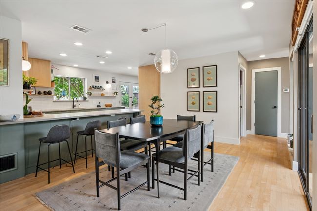 Open concept dining with abundant light flowing throughout. | Image 11