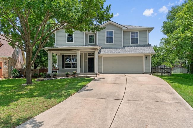 Traditional-style house featuring a porch, and 2 car garage. | Image 38