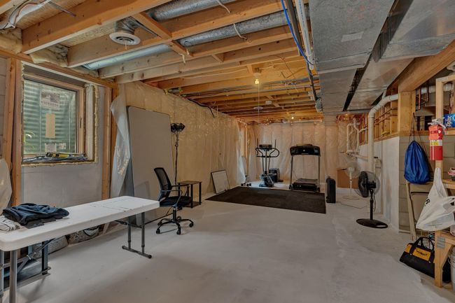 Unfinished lower level with newly added egress window | Image 23