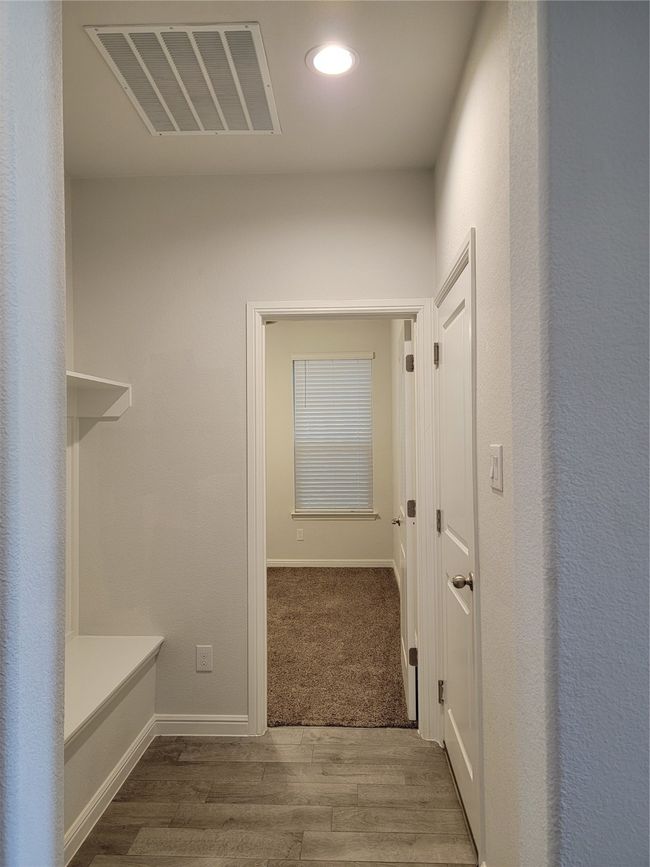 Hall featuring wood finished floors, recessed lighting, and baseboards | Image 21