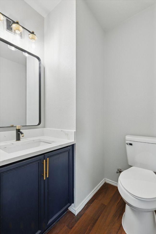 Half bath featuring wood finished floors and vanity | Image 15